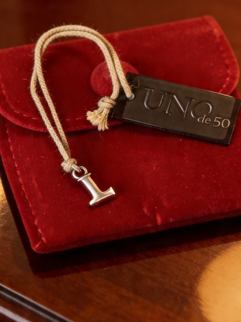 “L” Charm in Sterling Silver-Plated by UNO de 50